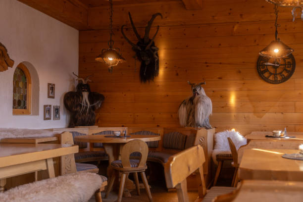 istock Cozy wooden dining area featuring unique decor and warm lighting in a rustic restaurant setting 2191459998