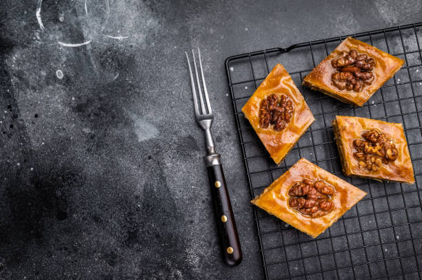 istock Traditional Honey Walnut Baklava. black background. top view 2191460909