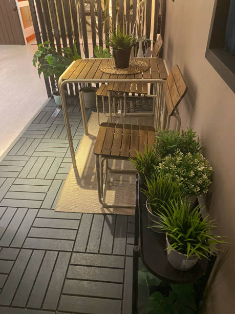 istock table and chairs in a terrace with green plants 2191465831