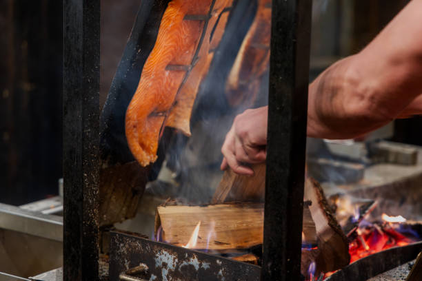 istock A Male Hand Preparing Flame-Cooked Salmon – A Nordic Tradition 2191467256