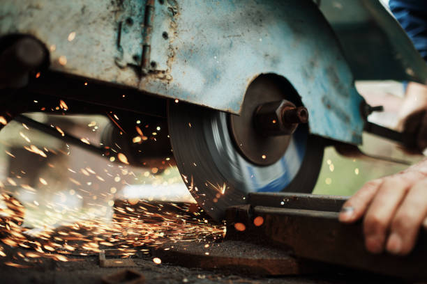 istock An elderly man grinds and cuts metal pipes on a grinding machine 2191467377