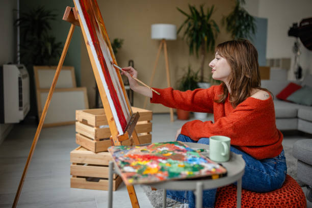 istock Artist painting on canvas immersed in creative process 2191468418