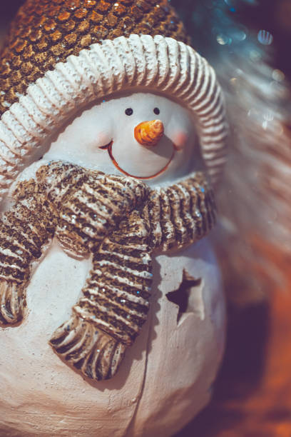 Festive snowman for decor. Ornament for winter holidays and joyful Christmas celebrations. Merry Christmas decoration. Happy New Year.