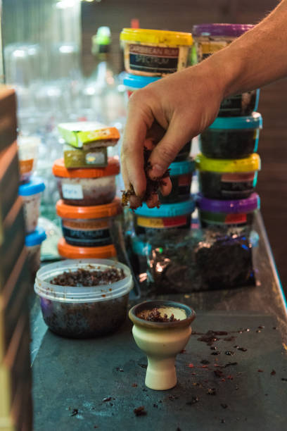 istock Shisha hookah preparing by barman. 2191471762