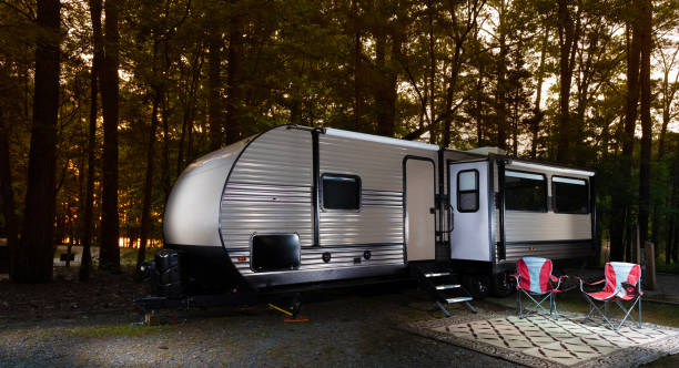 istock Camper trailer in a morning forest 2191471831