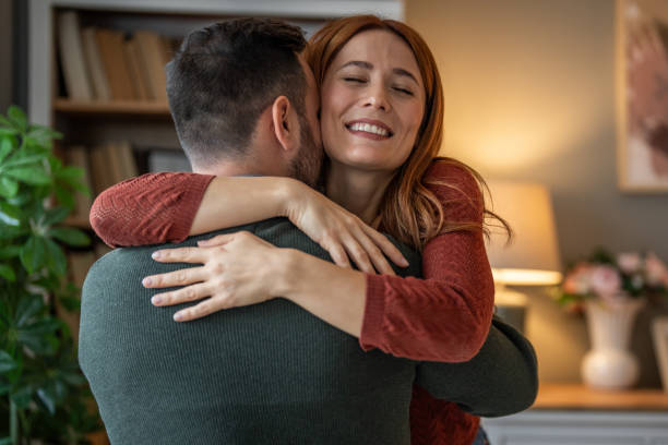 istock A beautiful couple sharing a tender hug in close-up 2191471959