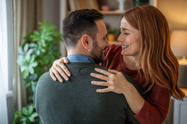 istock A beautiful couple sharing a tender hug in close-up 2191471960