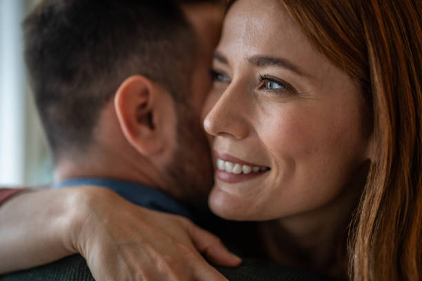 istock A beautiful couple sharing a tender hug in close-up 2191472010
