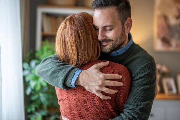 istock A beautiful couple sharing a tender hug in close-up 2191472025