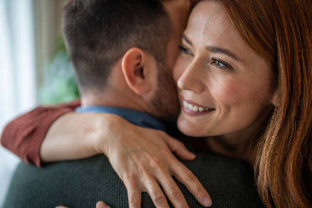 istock A beautiful couple sharing a tender hug in close-up 2191472038