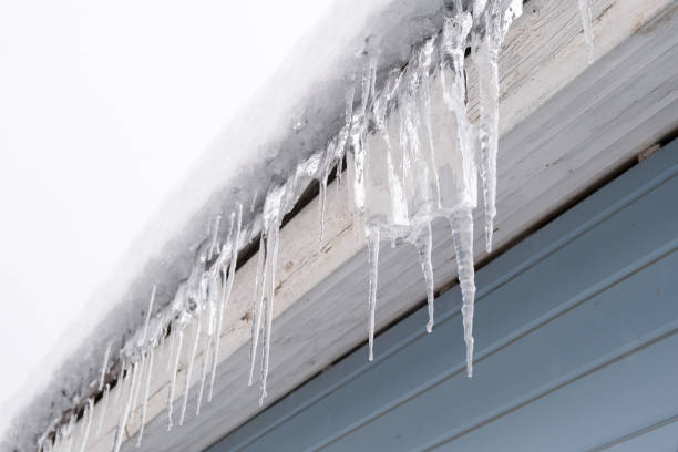 istock Beautiful icicles cascading from a roof and providing a view 2191473357