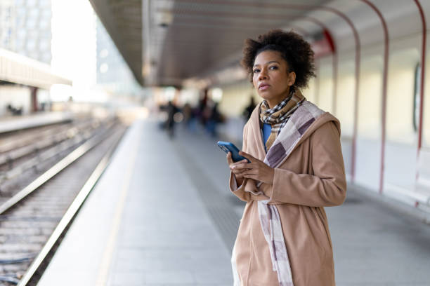 istock Woman using the phone at subway station 2191476048