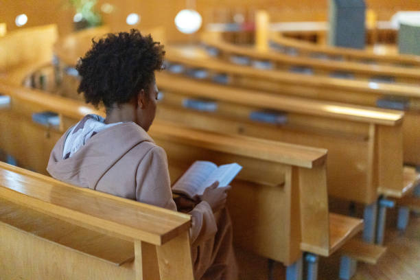 istock Woman in church 2191476090