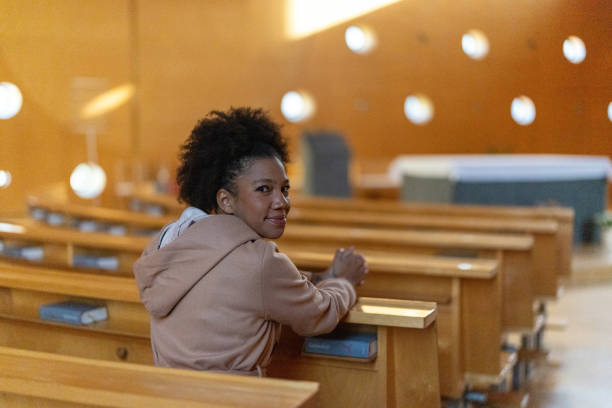 istock Woman in church 2191476118