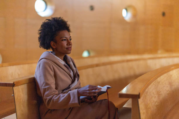 istock Woman in church 2191476184