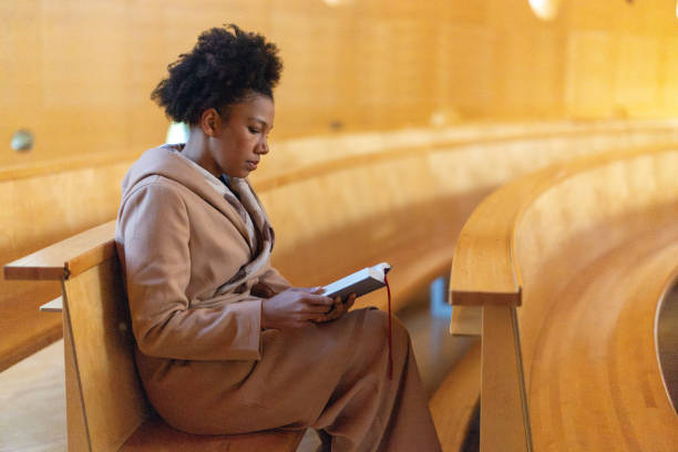 istock Woman in church 2191476732