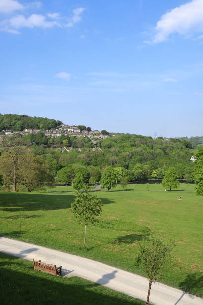istock Hilltop view in Shibden Park with a sunny path and bench. 2191476780