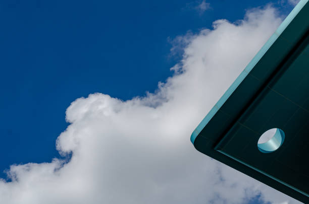 Germany, Berlin, Kreuzberg, July 09, 2024 - Low angle view of windmill blade against clear blue sky