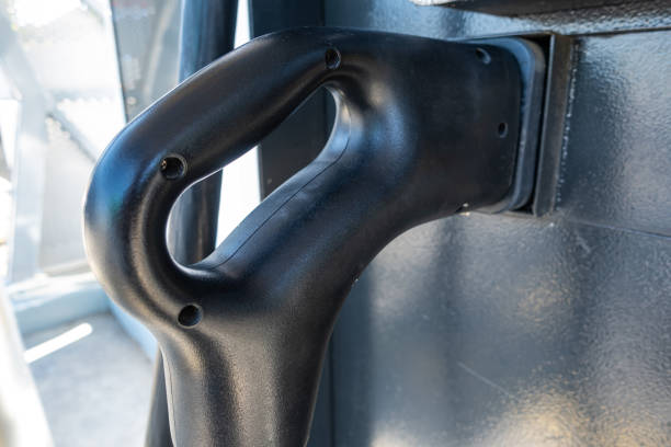 An electric vehicle (EV) charging high-voltage energy at an EV charging station replenishes its battery using direct current (DC) power delivered through a charging cable to the vehicle's onboard battery system