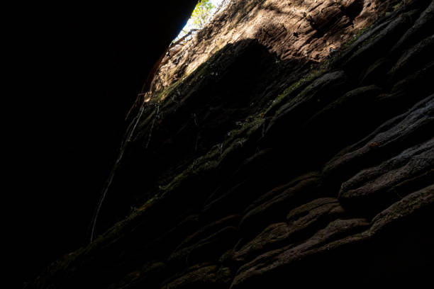 The Naga Cave in Bueng Kan, Thailand, features serpent-like rock formations tied to Naga mythology, attracting visitors to Phu Langka National Park for nature and spirituality