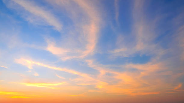 istock Sunset sky background in the evening with yellow sunlight cloud on blue dusk sky 2191481389