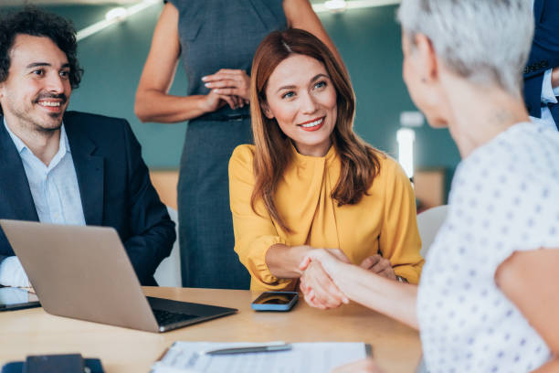 istock Shaking hands with new colleague 2191482399
