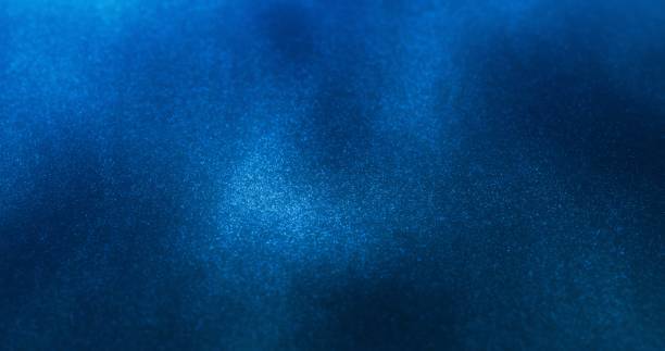istock A rich, deep blue background with a subtle, sparkling texture of fine particles. 2191482694