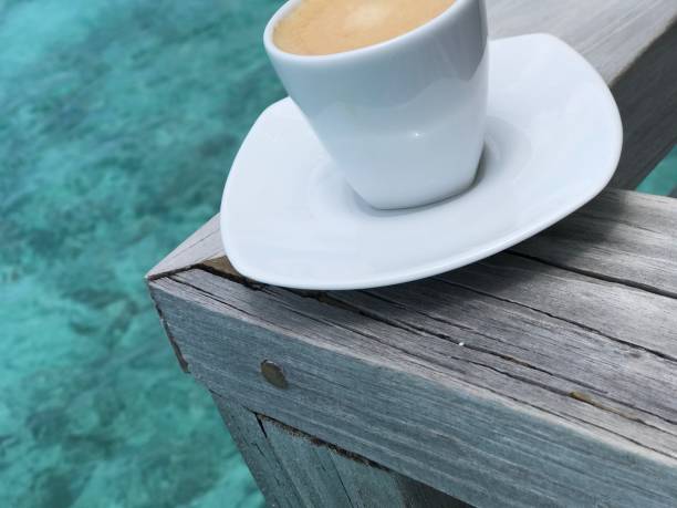 Espresso coffee on wood in Maldives, Indian Ocean sea