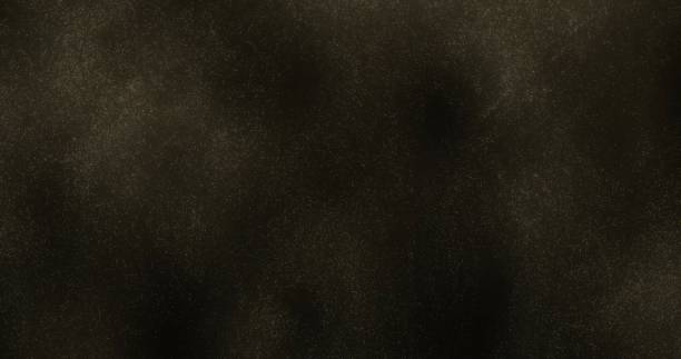 istock A dark background with dense shimmering golden particles swirling dynamically. evokes a sense of mystery and wonder. 2191482731