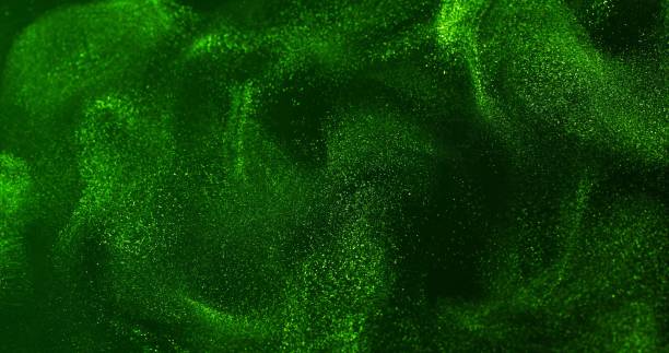istock A vibrant green surface with swirling, wave-like patterns and shimmering fine particles, creating a dynamic, abstract texture. 2191483125