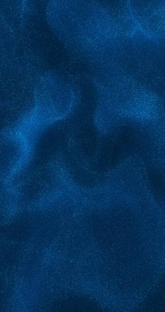 istock A dark blue background with shimmering particles subtly floating across the surface, adding depth and a sense of movement. 2191483227