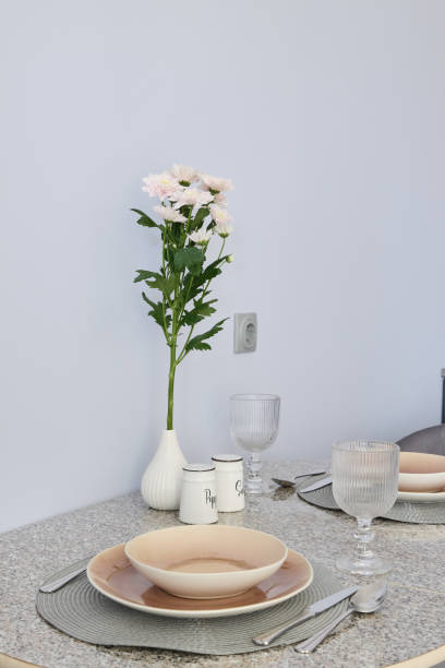 istock An Elegant Dining Setup Featuring Beautiful Flowers and Stylish Tableware for Guests 2191483475