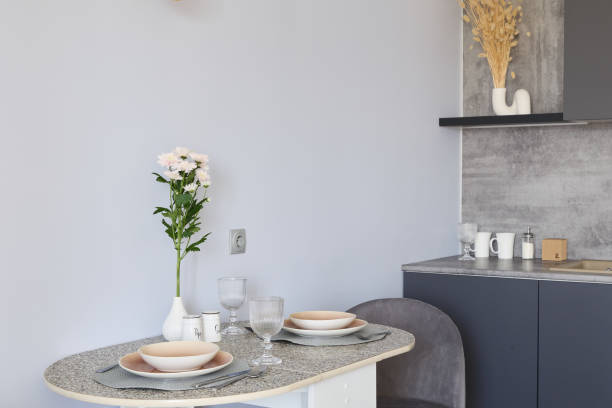 istock Explore the beauty of a Modern Minimalist Kitchen Decor featuring a warm Dinein Area 2191483574