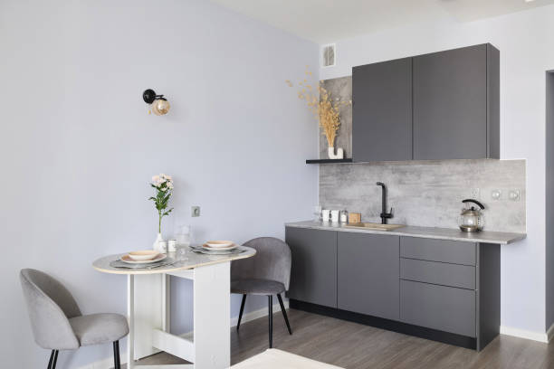 A Stunning Modern Minimalist Kitchen Designed with an Elegant Dining Setup for Enjoyment