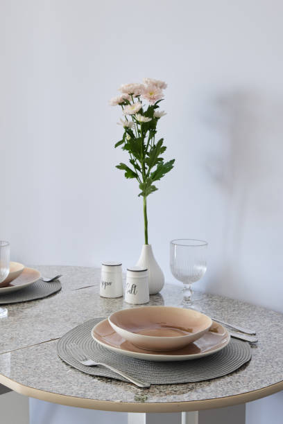 istock An Elegant Dining Table Setup Featuring a Beautiful Floral Centerpiece for Decoration 2191483695