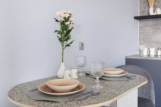 istock An Elegant and Modern Kitchen Table Setting Beautifully Decorated with Flowers and Glassware 2191483976