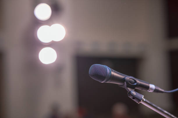 istock The foreground is a microphone on it, the background is blurred 2191485582