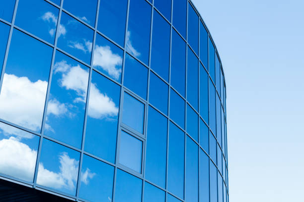 istock the mirrored wall reflects the sky and clouds 2191485599