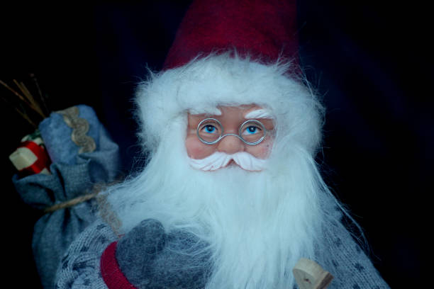 A Santa clause doll with glasses