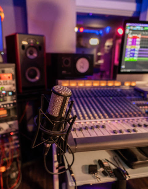 istock professional microphone with a sound mixer and studio monitors in a recording studio 2191488302
