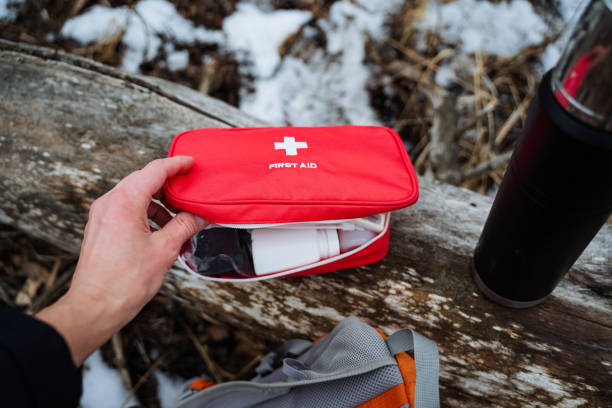 istock A person is holding a red first aid kit in their hand 2191489572