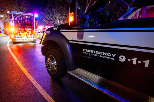 Close up emergency ambulance truck illuminated at night accident response