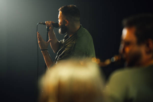 istock Singer performing with passion on stage during night concert 2191490270