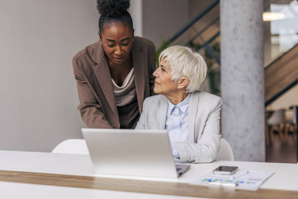 istock Two colleagues engage in business discussion 2191490905