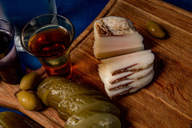istock vodka glass with pickled cucumber and bacon close-up 2191491999