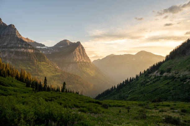 istock Rolling Green Hills Drop Into Light Filled Valley Below Mount Cannon 2191492036