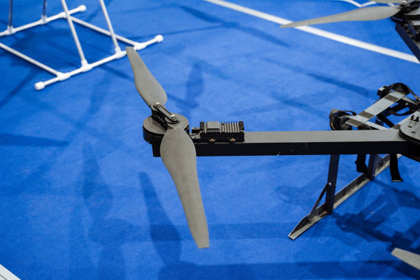 istock A small drone is positioned gently on a soft blue carpet, creating a striking and intriguing contrast that captures and captivates the eye in a warm and inviting indoor setting 2191492906