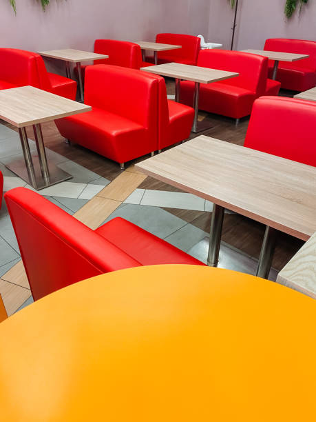 istock A row of red benches and tables in a restaurant 2191492921