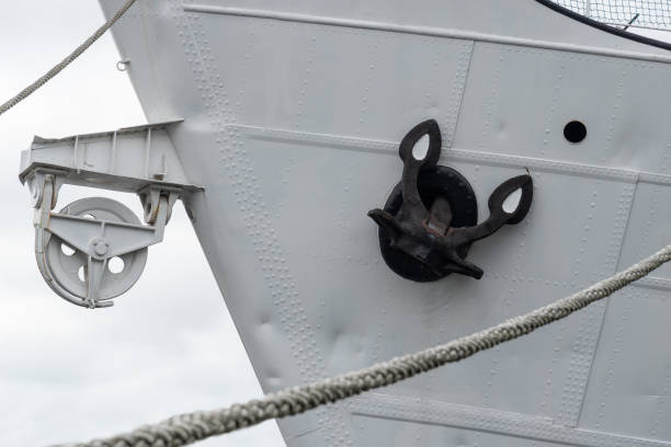 istock Black anchor on board a ship in port. 2191496477