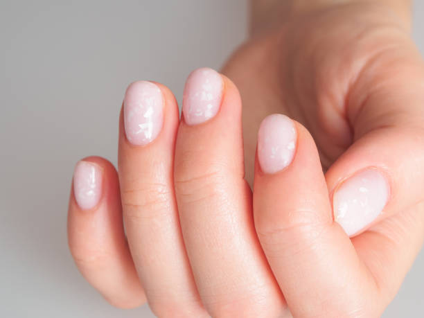 istock Light and delicate manicure with pastel colors, emphasizing well-groomed nails and an elegant look. 2191497109